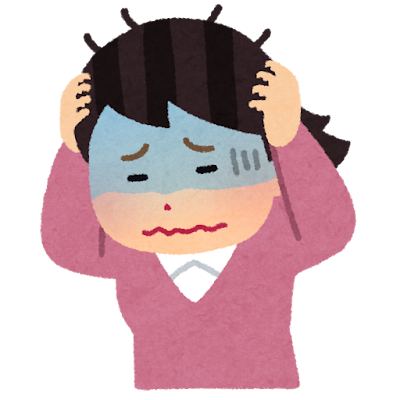 頭をかかえる女性